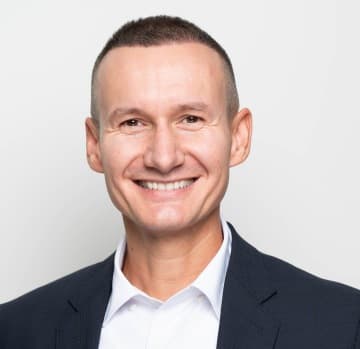 Michal Žán, Claims Settlement Diretor